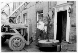 Bertie Bowen installing mill stone in front of Market Place House